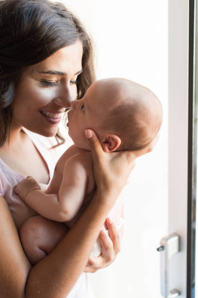 istock Woman with newborn baby 1253919227