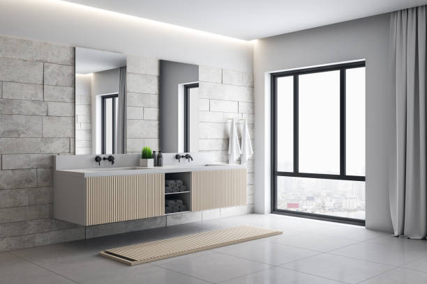 istock Modern loft bathroom interior with mirror and comfortable bathtub. 1253919341