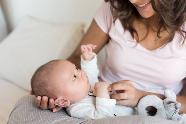 istock Mother with newborn baby 1253920178