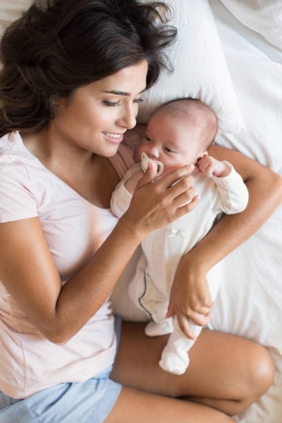 istock Mother with baby 1253920185