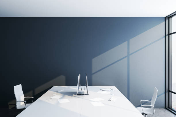 istock Contemporary coworking office interior with blank gray wall. 1253920390