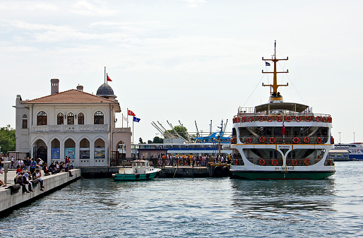 Istanbul, Turkey - June 14, 2020: People are getting inside the boat in Kadikoy ferry port on marmara sea in summer at kadıköy istanbul.