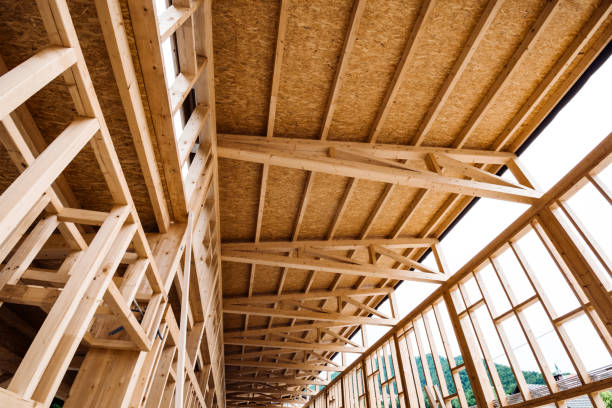 istock New house under construction - roof beams and frames 1253922067