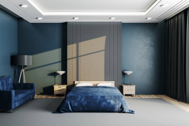 istock Modern bedroom with blue cover and blank wall. 1253922100