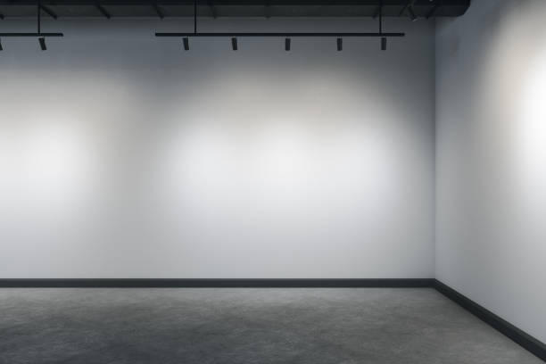 istock Concrete interior with corner, ceiling lamp and copy space on gray wall 1253922169