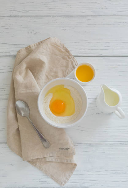 istock Ingredients for making pancakes, butter, flour, milk, egg, top view 1253923356