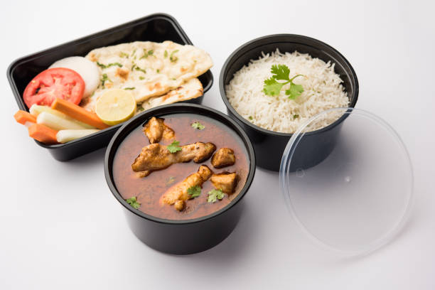 istock Butter chicken in black plastic container, ready for home delivery 1253925378