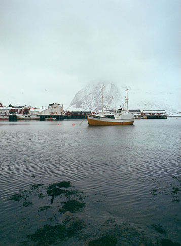 Tranquil scene of fishing village on Lofoten islands in winter. Camera film