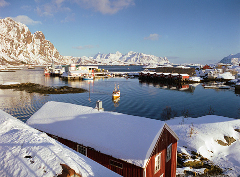 Tranquil scene of fishing village on Lofoten islands in winter. Camera film