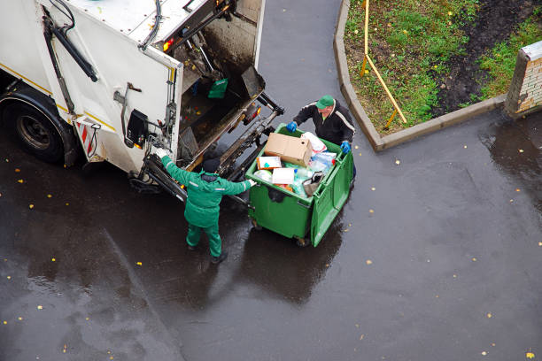 garbage removal in residential area, garbage men loading household rubbish in garbage truck Moscow 06/10/2019 Daily garbage removal in residential area, garbage men loading household rubbish in garbage truck truck in rain stock pictures, royalty-free photos & images
