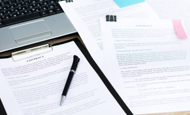 istock Contracts on the desktop close-up. Business concept 1253928753