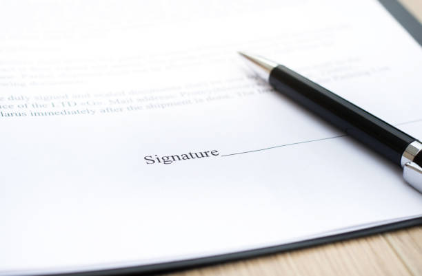istock Pen on contract paper. Contracts Business concept 1253928759
