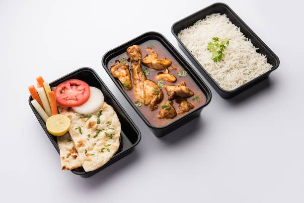 istock Butter chicken in black plastic container, ready for home delivery 1253928947