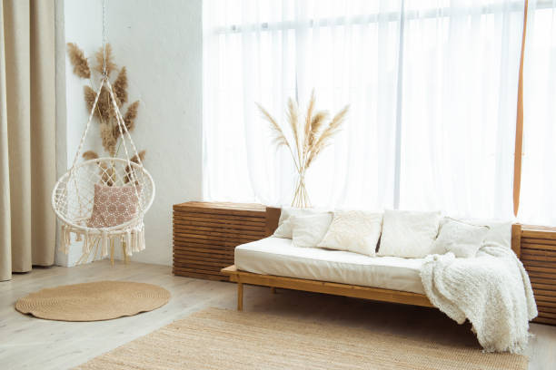 istock Modern living room design with sofa and swing chair 1253928985