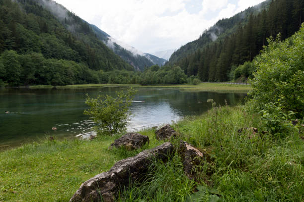 istock Green lake in the Austria Alps 1253930841