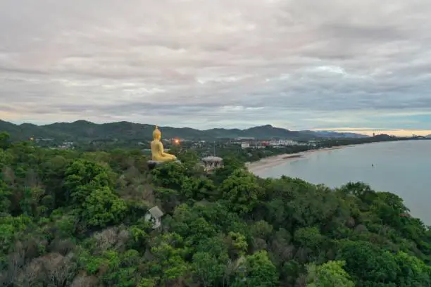 Photo of Buddha statue rests above the mountain in Hua Hin Thailand