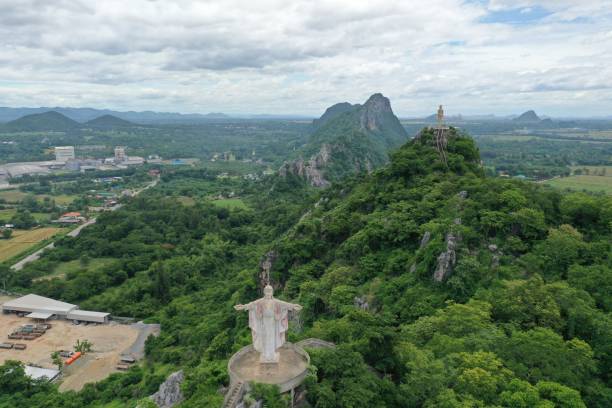 istock Buddha statue rests atop mountain range in Ratchaburi Thailand 1253931164
