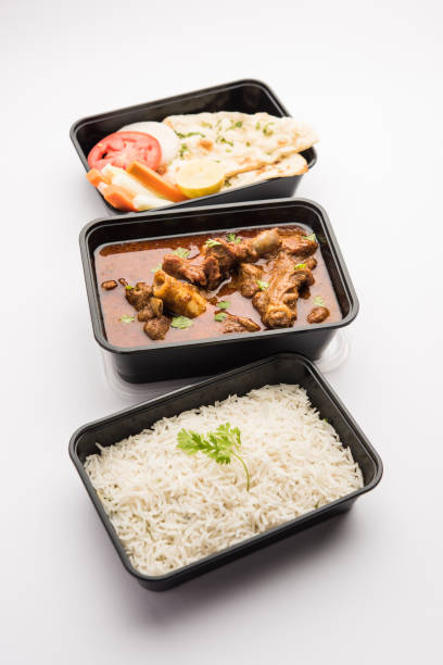 istock Mutton Masala Curry in plastic container for home delivery 1253934844