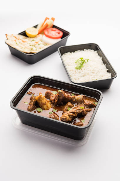 istock Mutton Masala Curry in plastic container for home delivery 1253934865