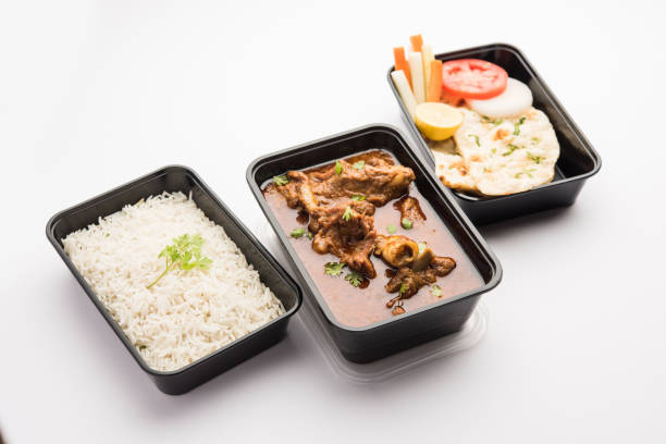 istock Mutton Masala Curry in plastic container for home delivery 1253934958