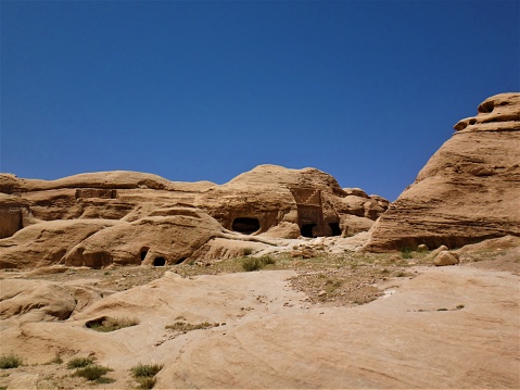 The most incredible lost city of Petra in Jordan with ancient buildings carved into the cliffs, donkeys and camels