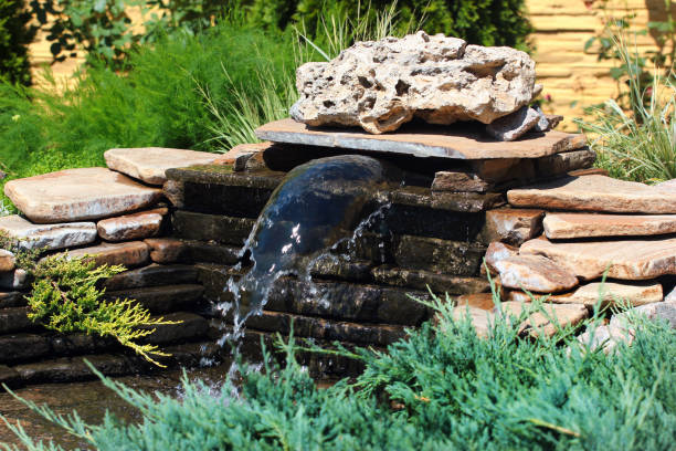 istock Small rockery with waterfall in a garden 1253941503