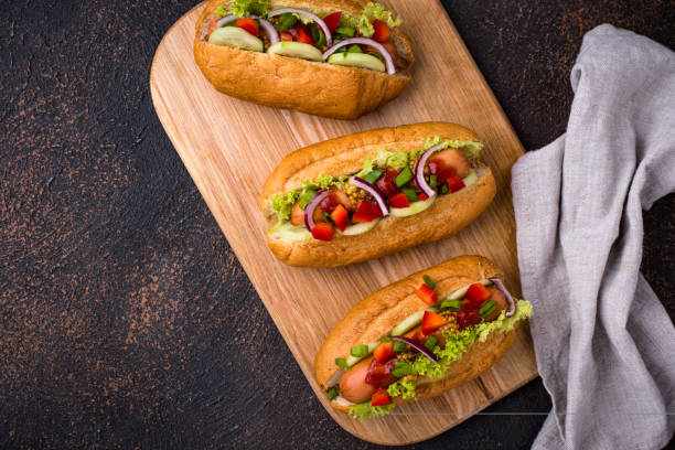 istock Hot dogs with sausage, sauces and vegetables 1253941509