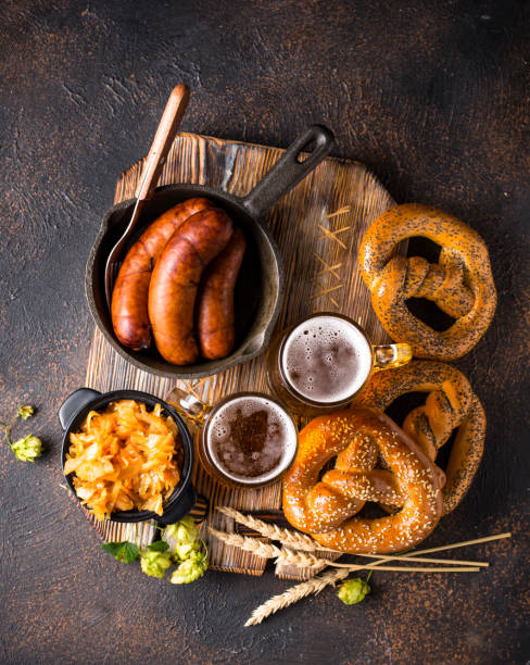 Beer, pretzels and Bavarian food Beer Fest concept. Beer, pretzels and traditional Bavarian food weisswurst photos stock pictures, royalty-free photos & images