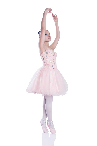 Young ballerina practicing with beautiful outfit - Studio shot