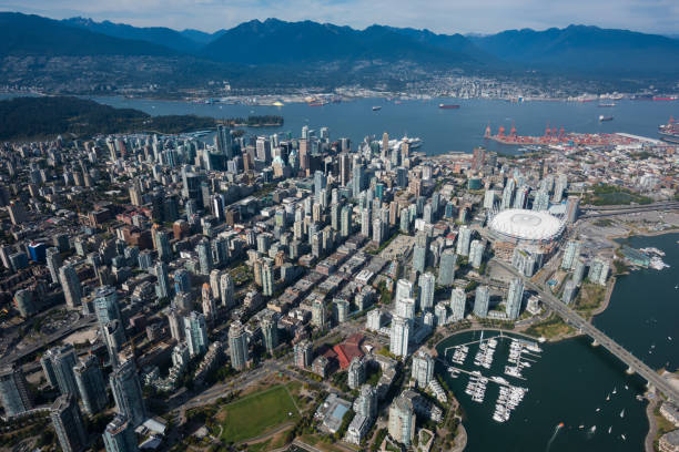 Aerial view of Vancouver in summer Sky view of downtown Vancouver, BC. Vancouver is British Columbia's largest city. false creek stock pictures, royalty-free photos & images