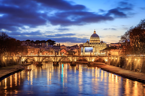 Panoramic view of Rome from Tiber river with Vatican city in the background and Saint Peter Basilica