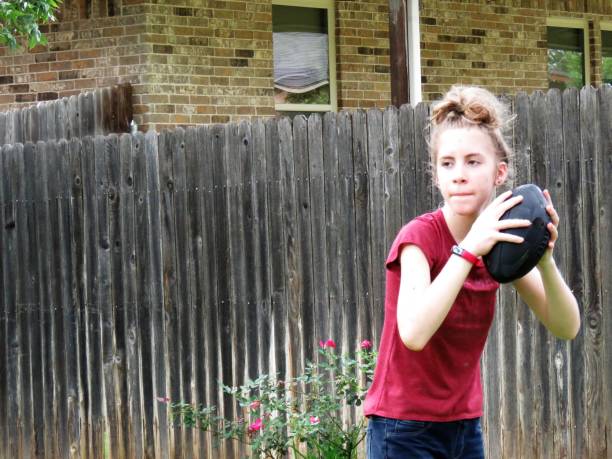 Football: Girl throws American Football