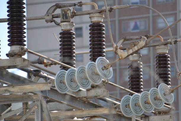 istock Plastic and glass isolators on high voltage powerlines at an electrical sub station 1253959784