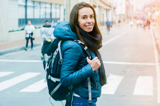 istock Portrait of beautiful backpacker smiling at camera 1253961532