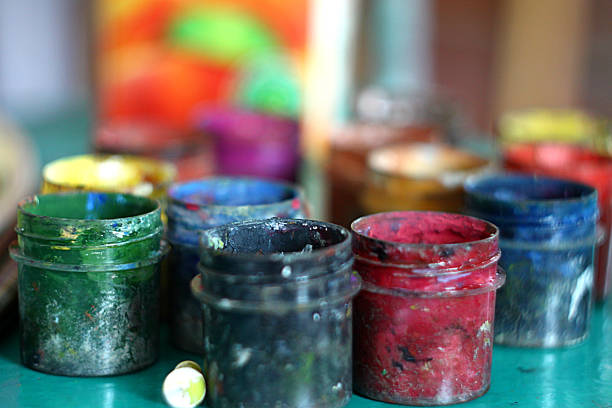istock Art creativity painting. Paints and brushes in cans close-up 1253966035