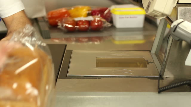 Barcode scanner at shopping cash register - Supermarket store groceries
