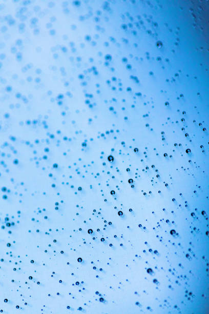 istock Rain Droplets on Handheld Device Technology Screen Background Texture Macro Photography Series 1253969549