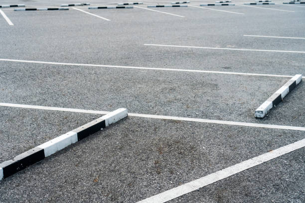 istock Empty slot of car park nobody background. 1253971122