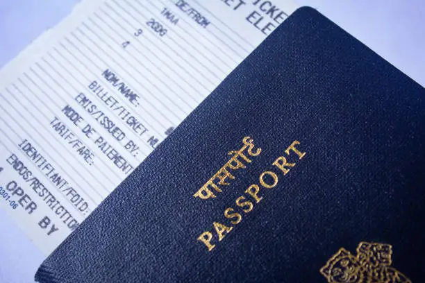 Photo of Valid travel document in flight boarding pass and passport. Republic of India passports.