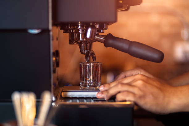istock Barista making fresh coffee with coffee machine in cafe 1253975530