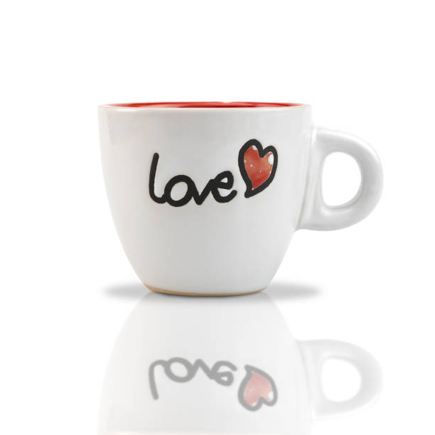 istock White ceramic coffee cup with red heart shape pattern and text LOVE isolated onwhite background. with clipping paths. 1253980081