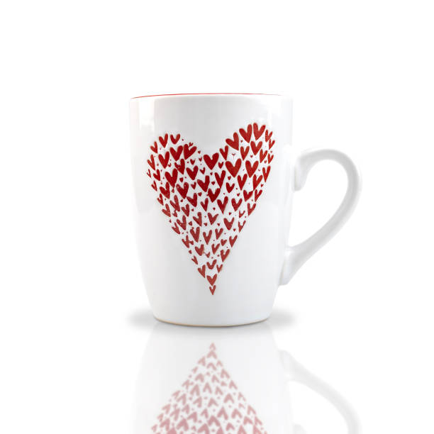 istock White ceramic coffee mug with red heart pattern isolated on white background. with clipping paths. 1253980083