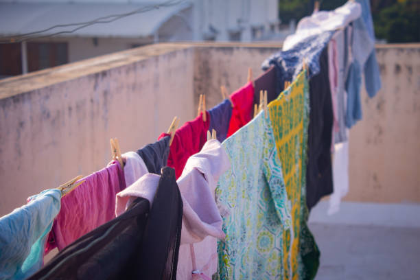 istock Washed clothes been dried under the sun in natural way. 1253983215