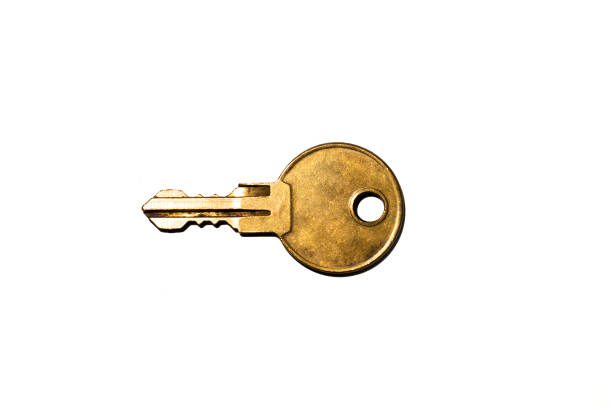 istock Old golden key isolated on white background 1253986810