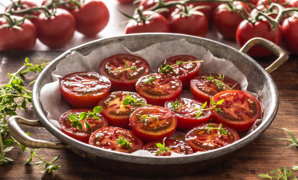 istock Fresh tomatoes in pan ready to dry or roasted 1253987393
