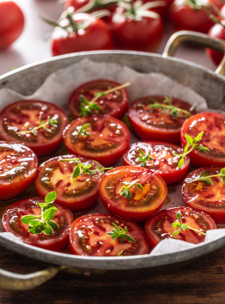 istock Fresh tomatoes in pan ready to dry or roasted 1253987416