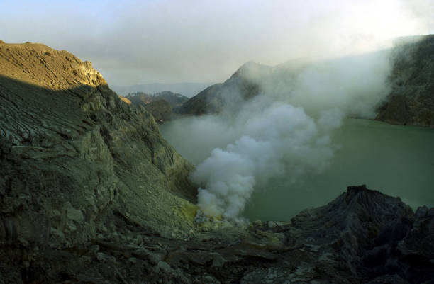 istock Smoke rises from the volcanic crater 1253989244