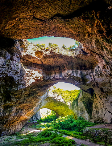 Devetashka cave is a large karst cave near the village of Devetaki on the east bank of the river Osam, in Bulgaria. Now home to nearly 30,000 bats.