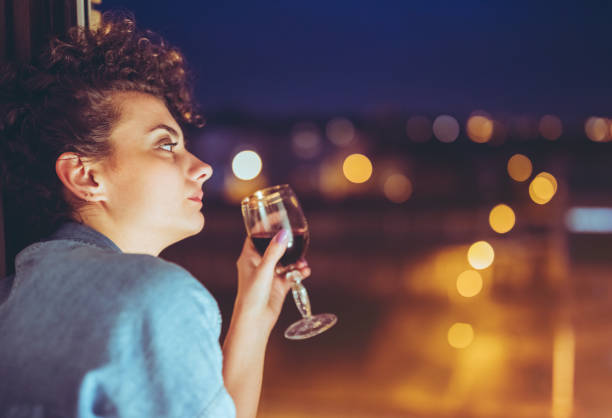 istock Young woman drinking wine 1253991669