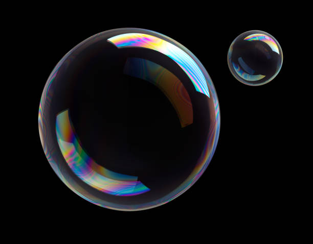 Soap Bubbles on black background Two colorful soap bubbles flying on black background froth decoration stock pictures, royalty-free photos & images